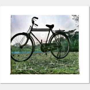 Bicycle and sunset Posters and Art